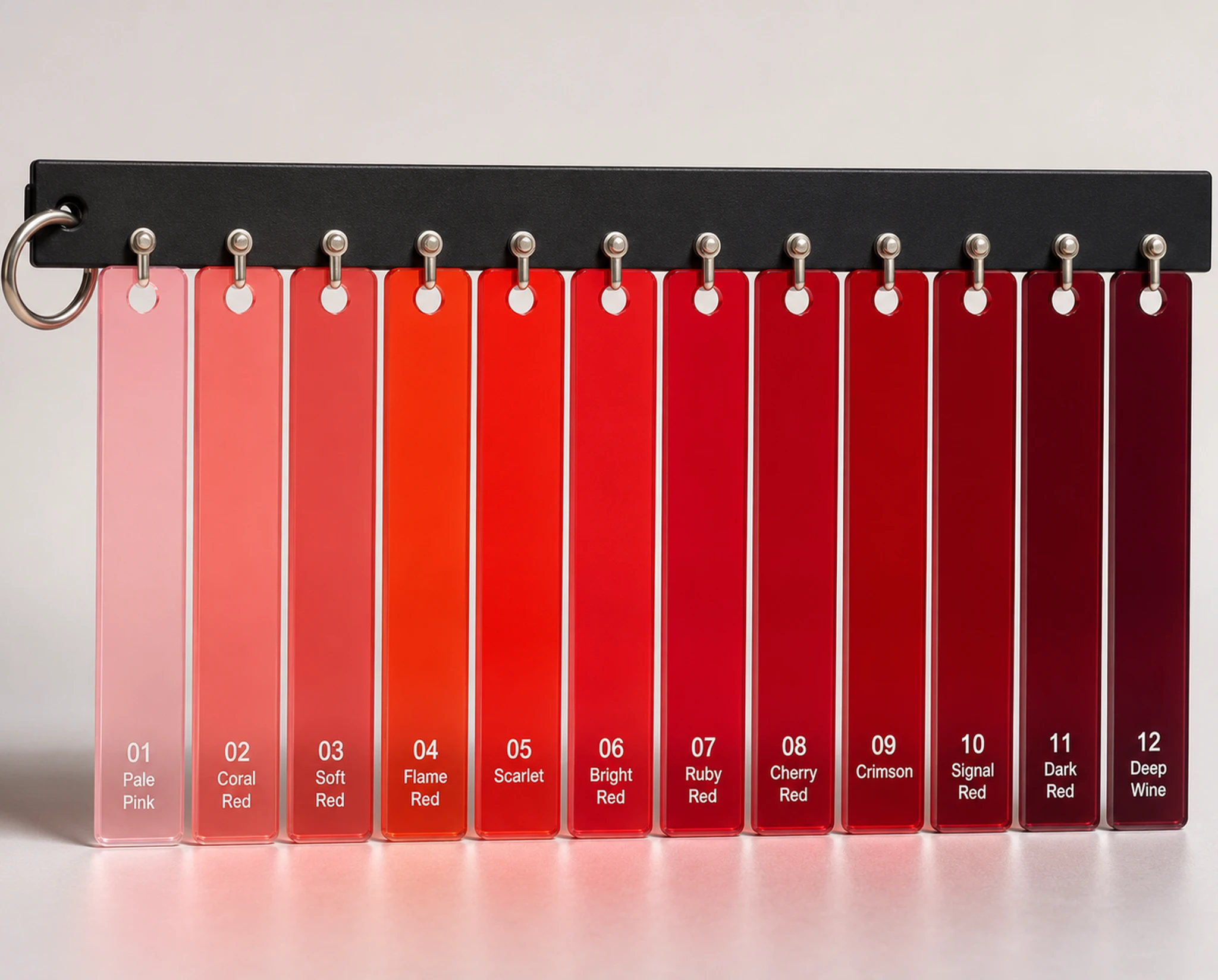 Red theatre lighting gel sampler with twelve translucent red swatches labelled from pale pink to deep wine — synthographic artwork by davidname.
